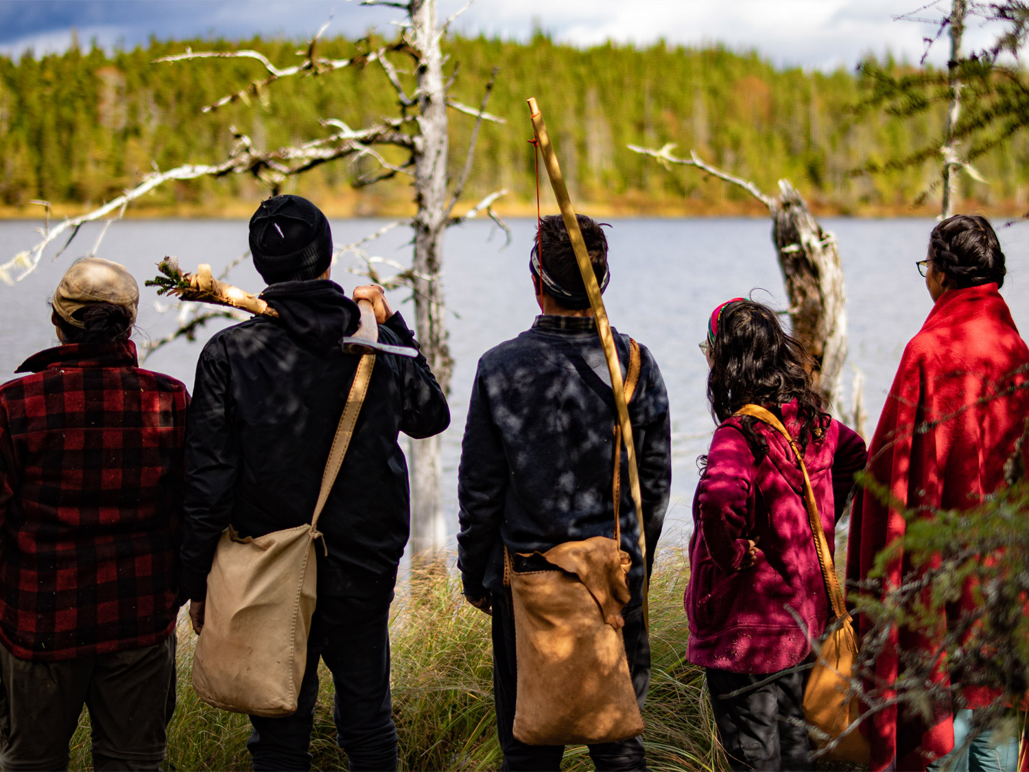 A group of indigenous people overlooking a lake in Ontario.